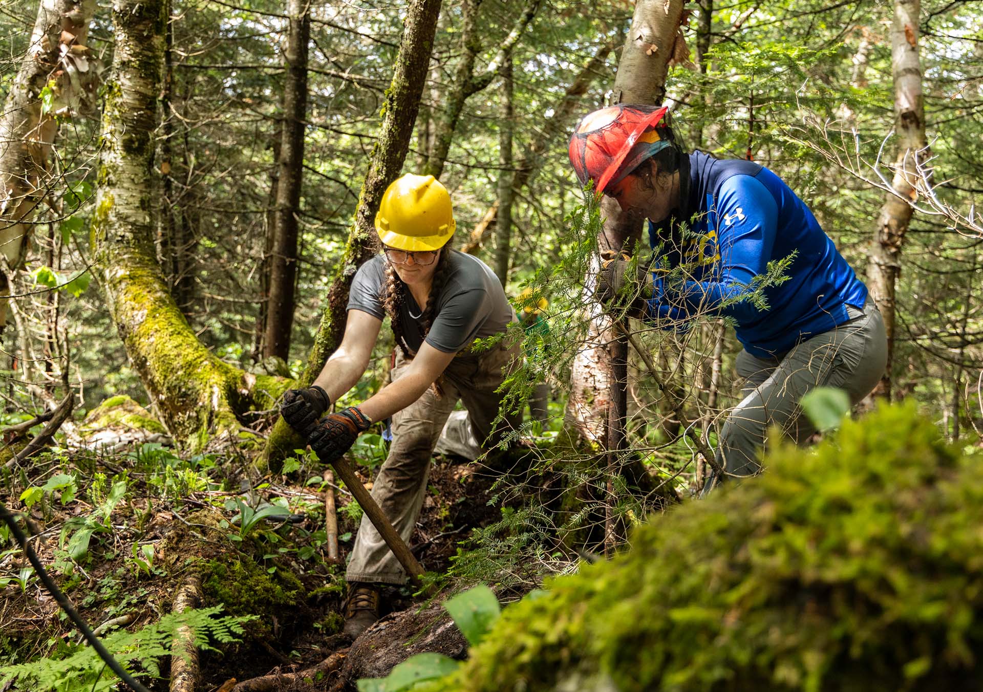 Trail crews practice quarrying rocks on the Burrows Trail