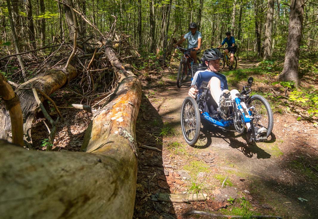 Accessible mountain biker on trail