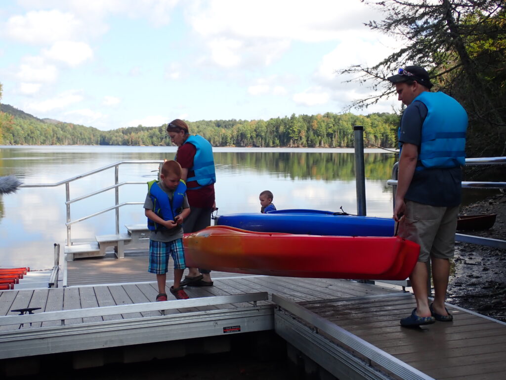 family loading boats at accessible boat dock at Green River Resevoir