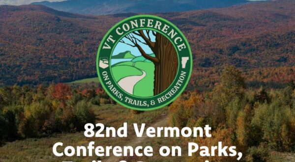 VT fall foliage in mountains with logo of Vermont Conference on Parks, Trail, Recreation in middle
